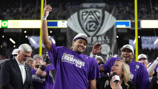 Washington Huskies wide receiver Rome Odunze is interviewed y ESPN reporter Holly Rowe after his team’s win over the Oregon Ducks in the Pac-12 championship game in Las Vegas on Dec. 1, 2023.